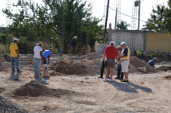 Larry and Ron consult with Lorenzo, our contractor.