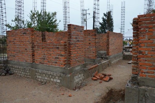 Offices. The grey brick is foundation. The floor will be almost a meter higher than where we stand now.