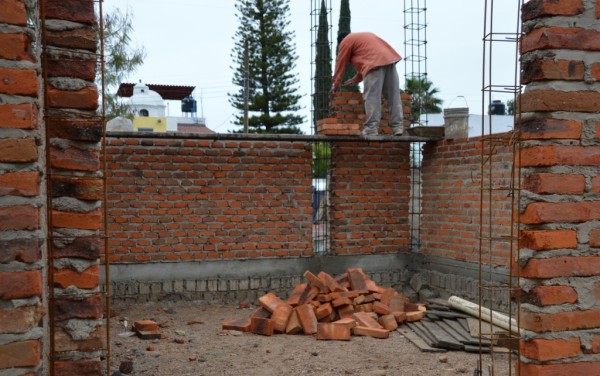 Working on the next level of brick.