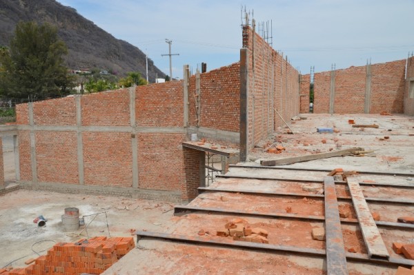 The angled wall is an inside wall -- between the narthex and the sanctuary.