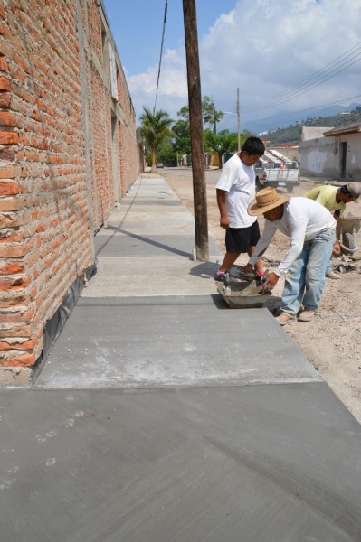 Working on the new sidewalk.