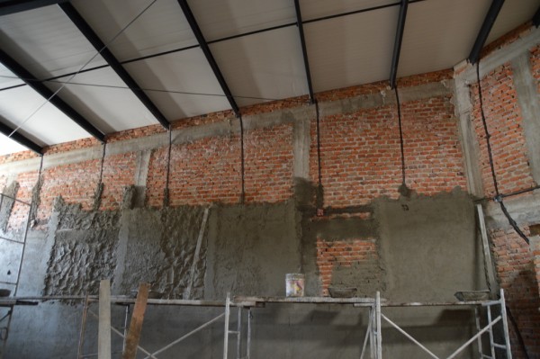 Plastering is happening, too -- almost simultaneously.