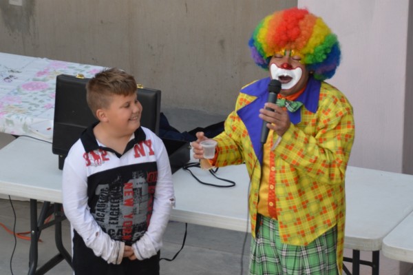 We laughed with the clown.